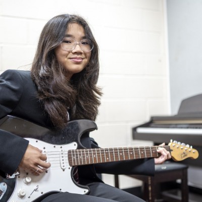 Girl Playing guitar